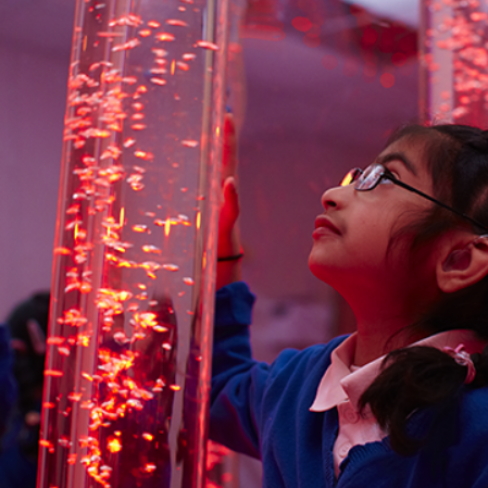 child with bubble tube